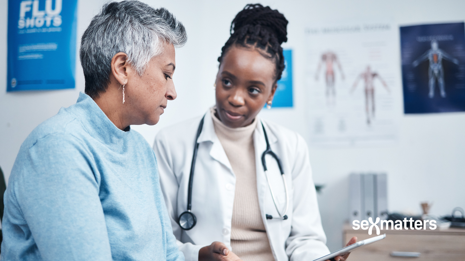 Healthcare – a female nurse talking to a female patient