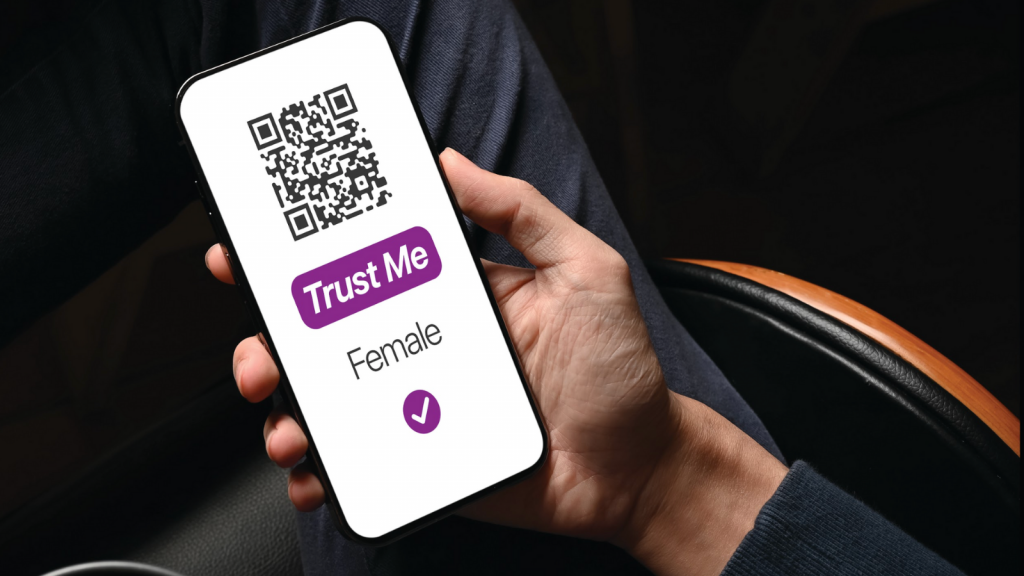 Phone held in male hand has text "Trust me – FEMALE"