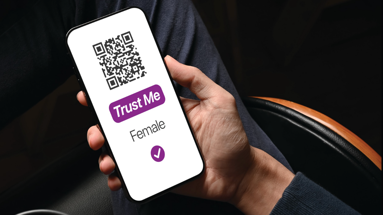 Phone held in male hand has text "Trust me – FEMALE"